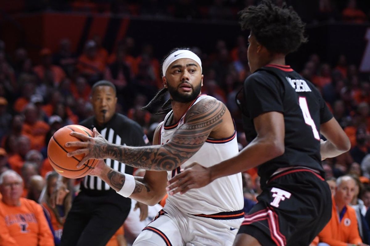 Nov 11, 2025; Champaign, Illinois, USA; Illinois Fighting Illini guard Kylan Boswell (4) drives to the basket as Texas Tech Red Raiders guard Christian Anderson (4) defends during the first half at State Farm Center. Mandatory Credit: Ron Johnson-Imagn Images
