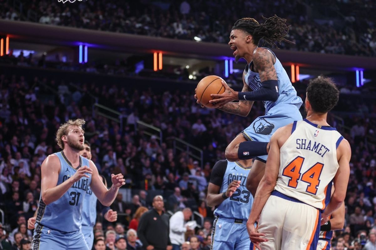 Nov 11, 2025; New York, New York, USA;  Memphis Grizzlies guard Ja Morant (12) drives past New York Knicks guard Landry Shamet (44) in the third quarter at Madison Square Garden. Mandatory Credit: Wendell Cruz-Imagn Images