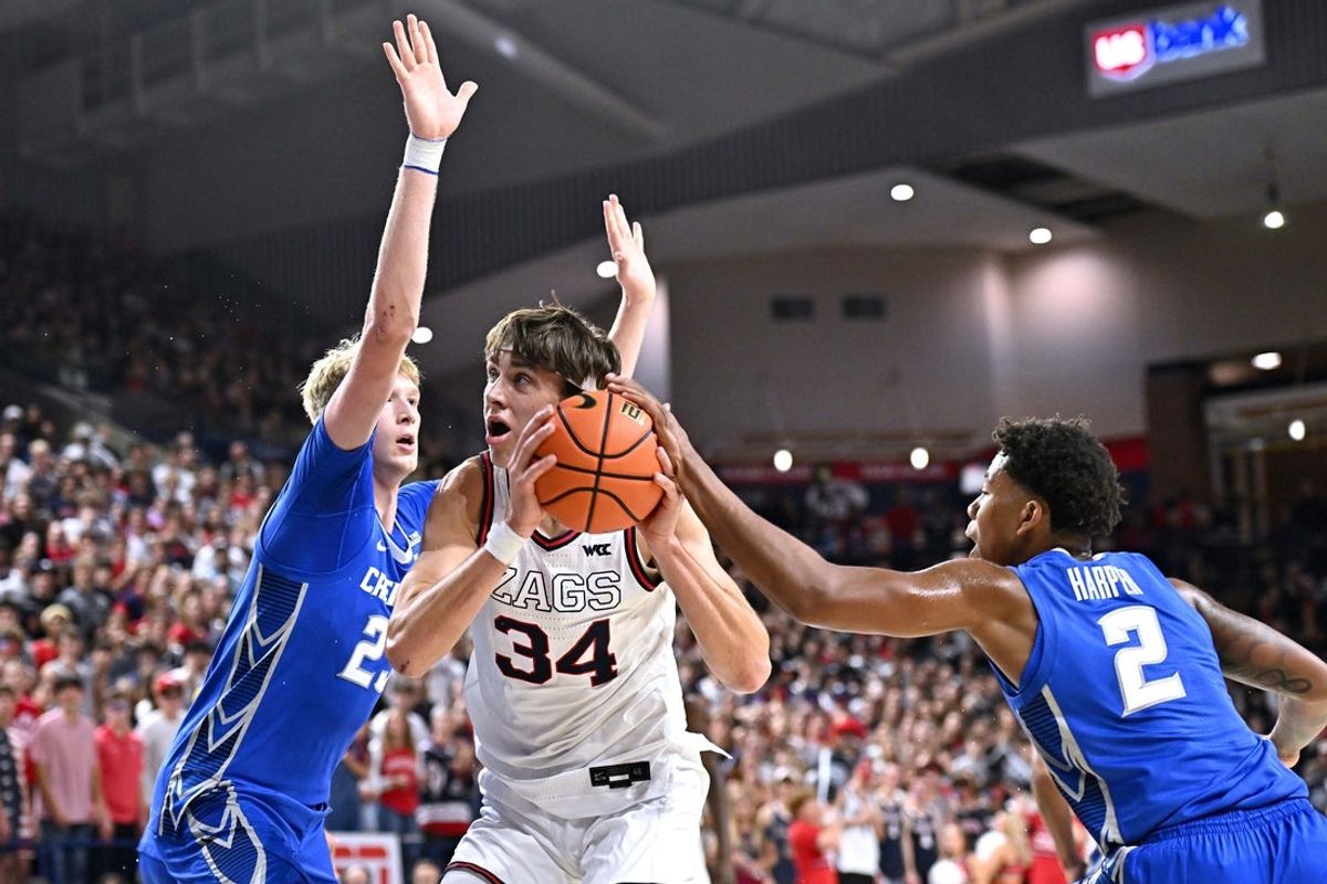 Nov 11, 2025; Spokane, Washington, USA; Gonzaga Bulldogs forward Braden Huff (34) shoots the ball against Creighton Bluejays forward Jackson McAndrew (23) and Creighton Bluejays guard Blake Harper (2) in the first half at McCarthey Athletic Center. Mandatory Credit: James Snook-Imagn Images