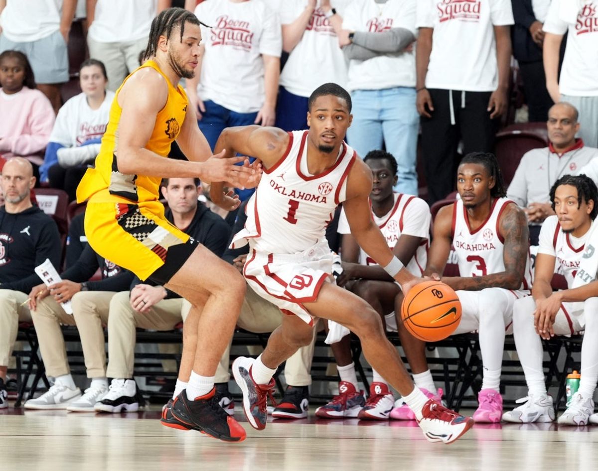 Oklahoma's Xzayvier Brown (1) drives to the basket as Arkansas-Pine Bluff 's Trevon Payton (20) defends in the second half of the college basketball game between the University of Oklahoma Sooners and the University of Arkansas-Pine Bluff at McCasland Field House in Norman, Okla., Tuesday Nov., 11, 2025.