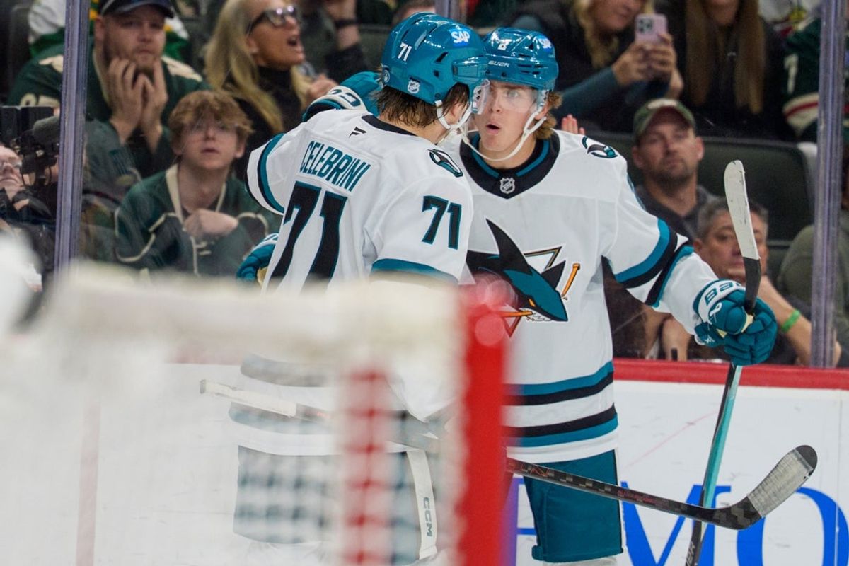 Nov 11, 2025; Saint Paul, Minnesota, USA; San Jose Sharks center Macklin Celebrini (71) congratulates center Will Smith (2) on scoring the tying goal against the Minnesota Wild late in the third period at Grand Casino Arena. Mandatory Credit: Matt Blewett-Imagn Images