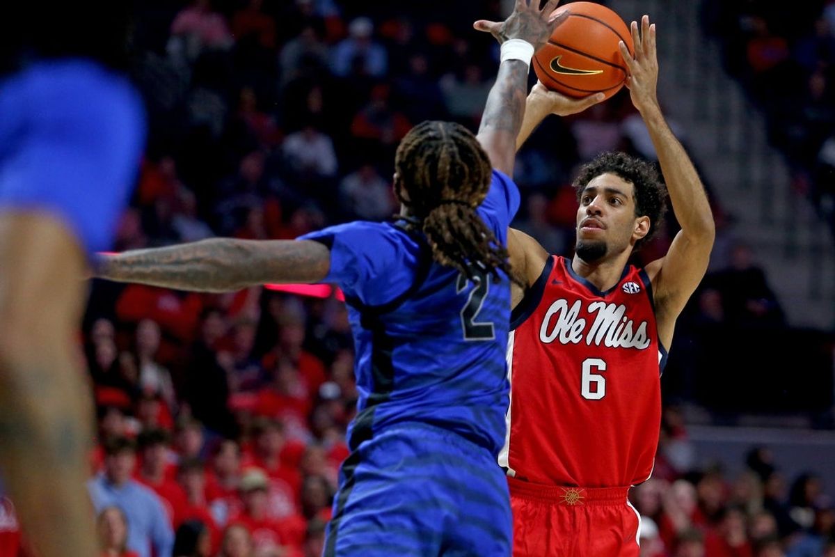 Nov 11, 2025; Oxford, Mississippi, USA; Mississippi Rebels guard Ilias Kamardine (6) shoots as Memphis Tigers guard Zach Davis (2) defends during the second half at The Sandy and John Black Pavilion at Ole Miss. Mandatory Credit: Petre Thomas-Imagn Images