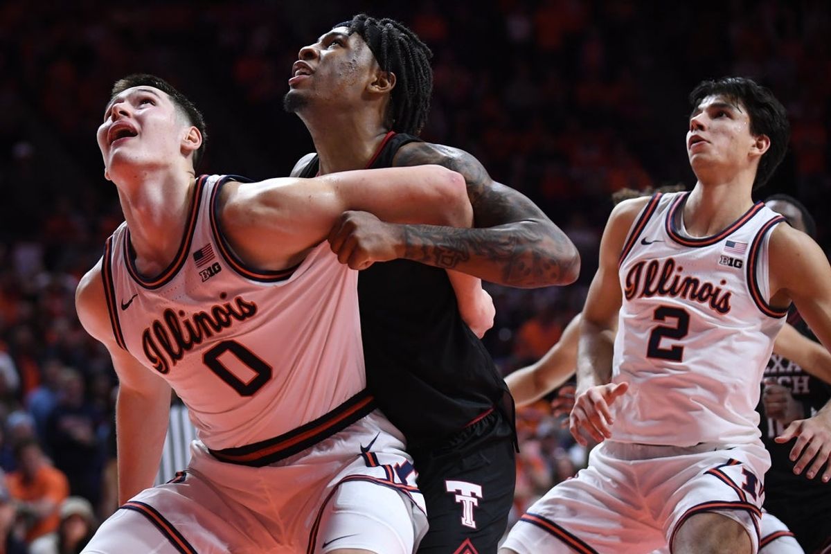 Nov 11, 2025; Champaign, Illinois, USA; Illinois Fighting Illini forward David Mirkovic (0) and Texas Tech Red Raiders forward JT Toppin (15) battle for position during the second half at State Farm Center. Mandatory Credit: Ron Johnson-Imagn Images