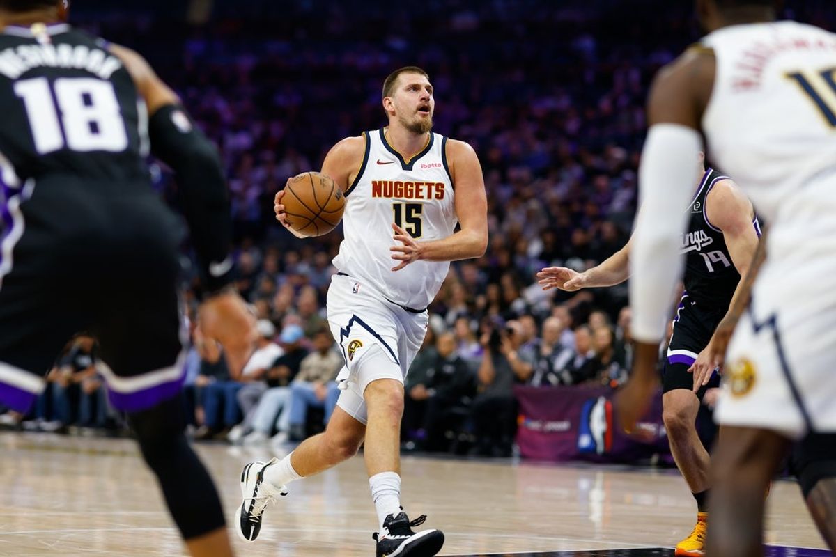 Nov 11, 2025; Sacramento, California, USA; Denver Nuggets center Nikola Jokic (15) drives to the basket against the Sacramento Kings during the second quarter at Golden 1 Center. Mandatory Credit: Sergio Estrada-Imagn Images
