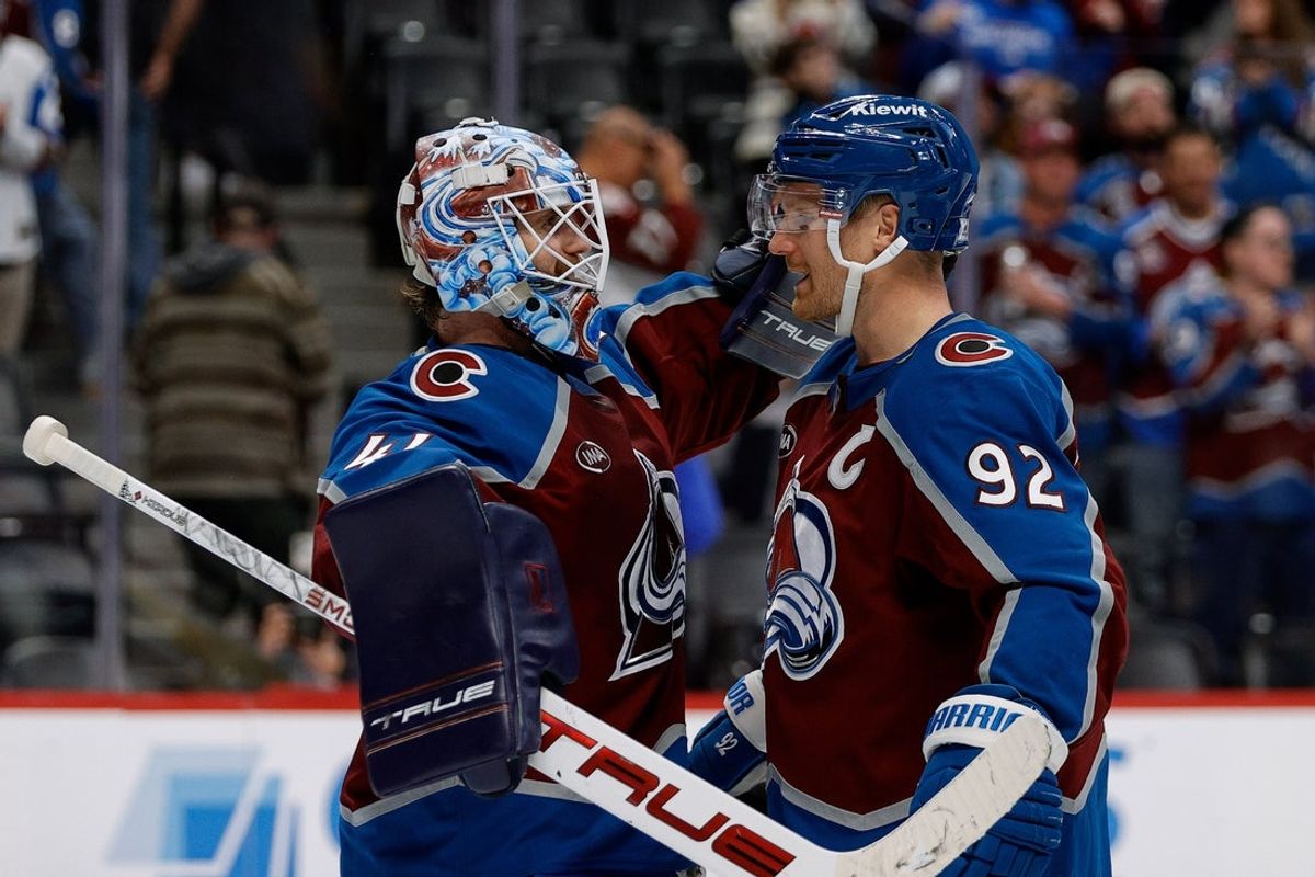 Nov 11, 2025; Denver, Colorado, USA; Colorado Avalanche goaltender Scott Wedgewood (41) celebrates with left wing Gabriel Landeskog (92) after the game against the Anaheim Ducks at Ball Arena. Mandatory Credit: Isaiah J. Downing-Imagn Images