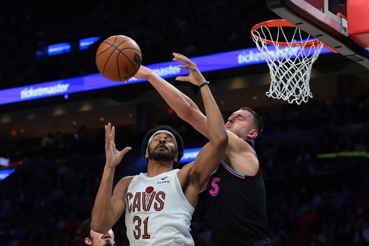 Nov 12, 2025; Miami, Florida, USA; Miami Heat forward Nikola Jovic (5) defends a pass intended to Cleveland Cavaliers center Jarrett Allen (31) during the second quarter at Kaseya Center. Mandatory Credit: Sam Navarro-Imagn Images