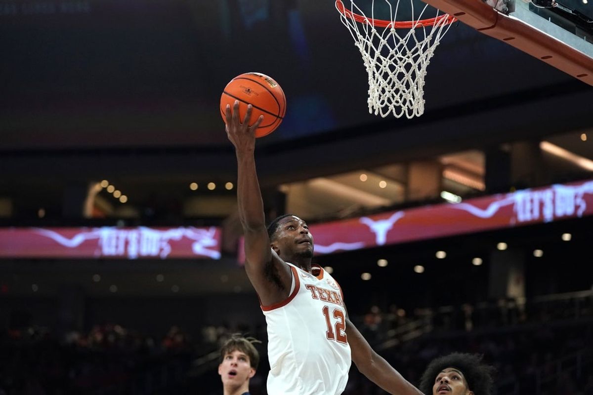 Nov 12, 2025; Austin, Texas, USA; Texas Longhorns guard Tramon Mark (12) drives to the basket during the first half against Fairleigh Dickinson at Moody Center. Mandatory Credit: Dustin Safranek-Imagn Images