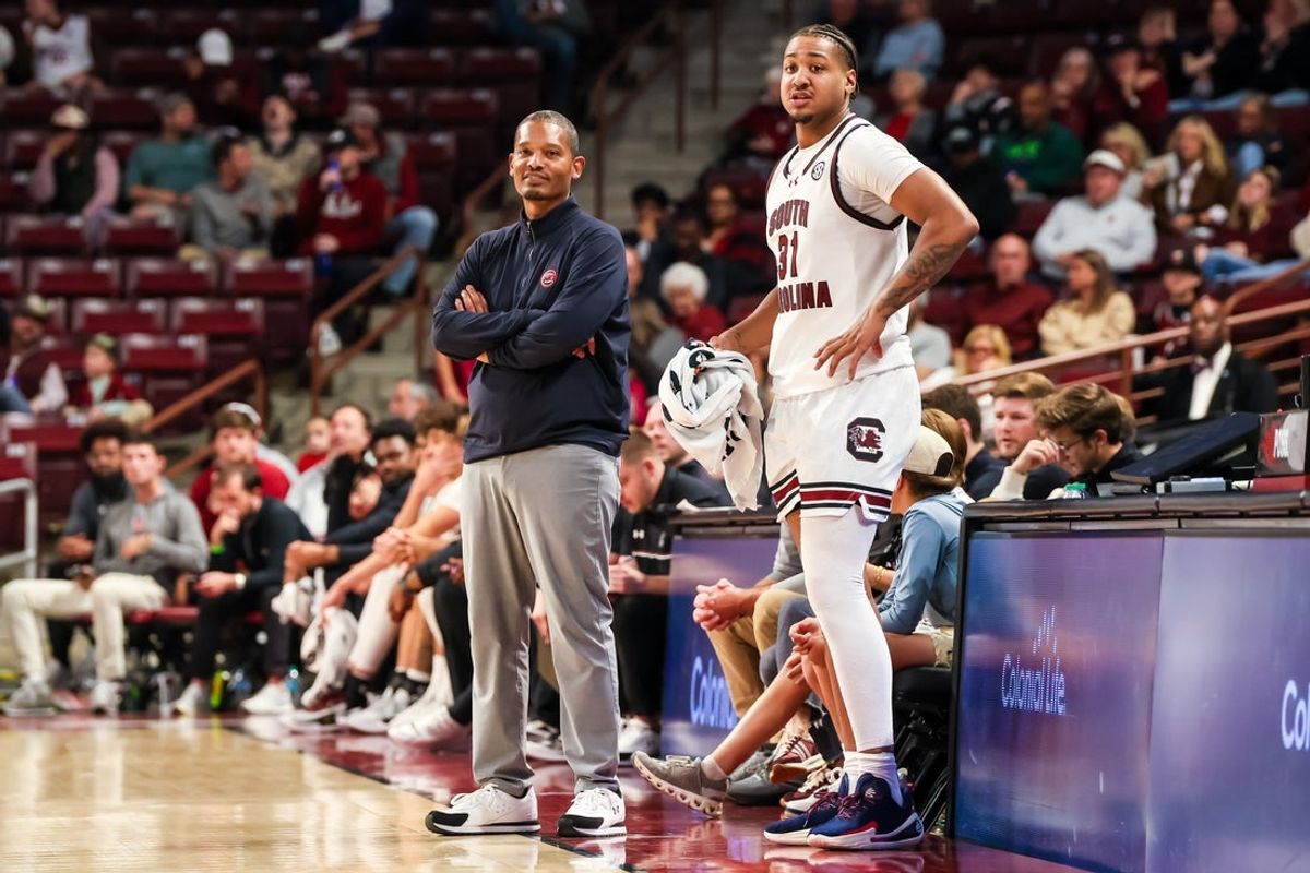 Nov 12, 2025; Columbia, South Carolina, USA; South Carolina Gamecocks head coach Lamont Paris speaks with forward Elijah Strong (31) against the Presbyterian Blue Hose in the second half at Colonial Life Arena. Mandatory Credit: Jeff Blake-Imagn Images
