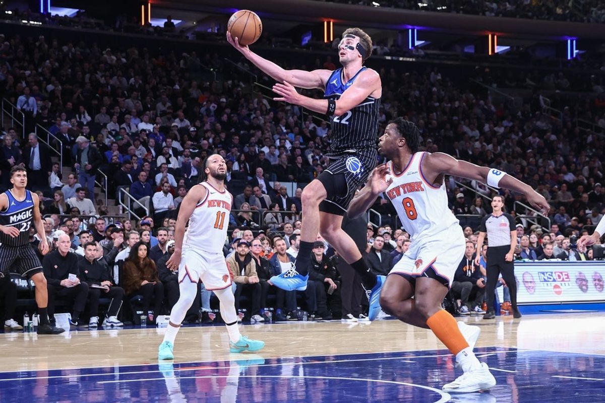 Nov 12, 2025; New York, New York, USA;  Orlando Magic forward Franz Wagner (22) drives past New York Knicks forward OG Anunoby (8) in the third quarter at Madison Square Garden. Mandatory Credit: Wendell Cruz-Imagn Images