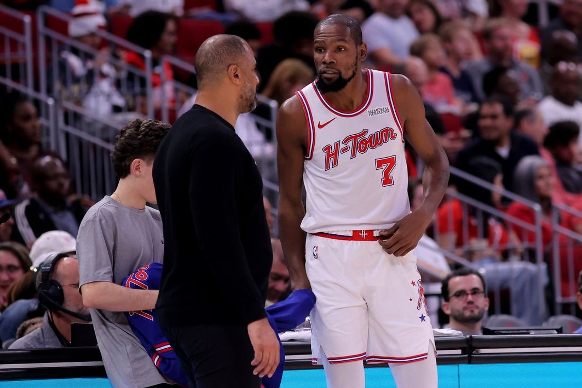 Nov 12, 2025; Houston, Texas, USA; Houston Rockets forward Kevin Durant (7) talks with Houston Rockets head coach Ime Udoka on the sideline against the Washington Wizards during the fourth quarter at Toyota Center. Mandatory Credit: Erik Williams-Imagn Images