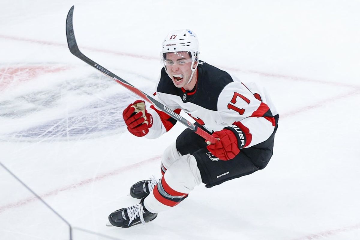 Nov 12, 2025; Chicago, Illinois, USA; New Jersey Devils defenseman Simon Nemec (17) celebrates after scoring a game winning goal against Chicago Blackhawks goaltender Spencer Knight during the overtime at United Center. Mandatory Credit: Kamil Krzaczynski-Imagn Images
