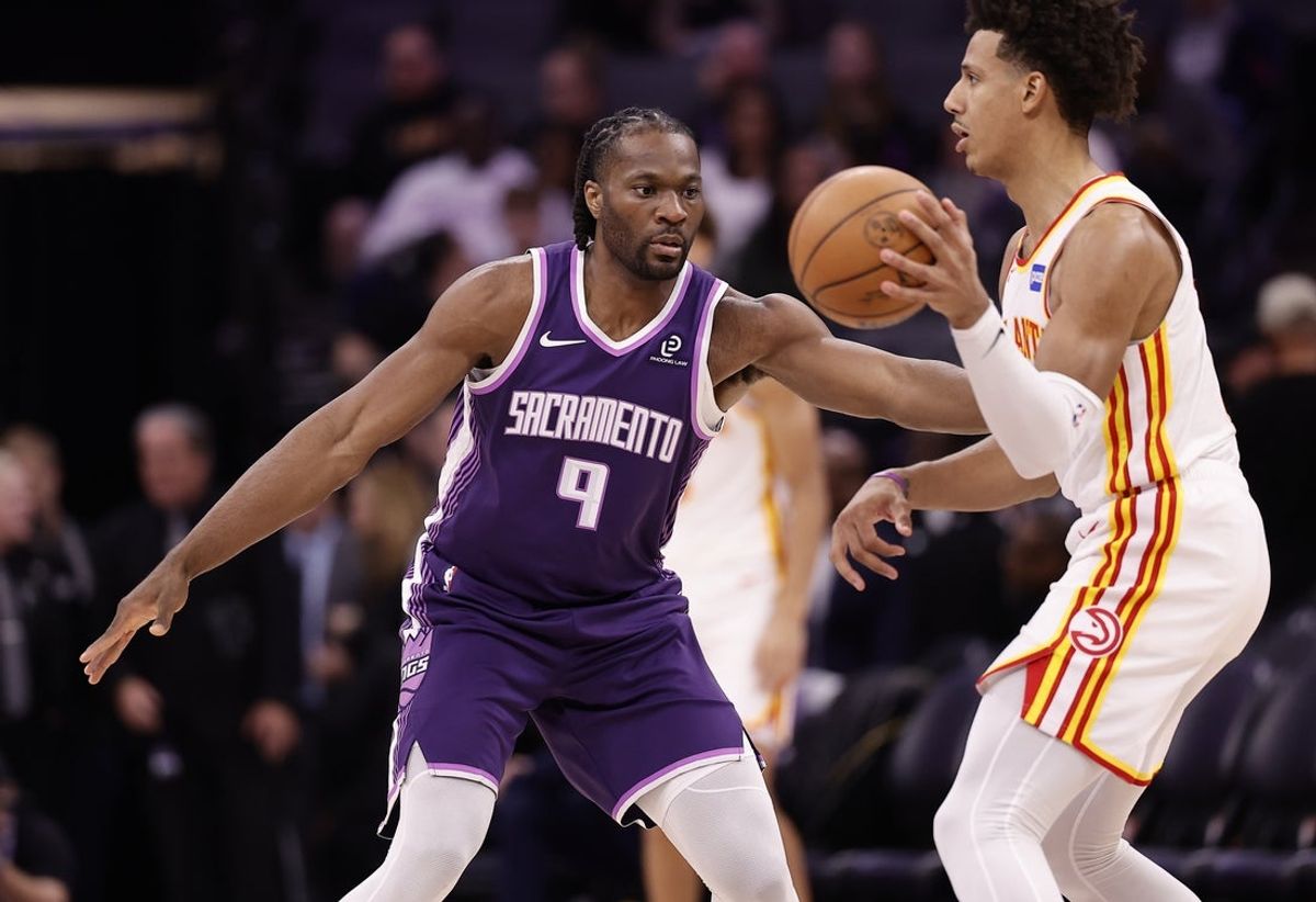 Nov 12, 2025; Sacramento, California, USA; Sacramento Kings forward Precious Achiuwa (9) defends Atlanta Hawks forward Jalen Johnson (1) during the third quarter at Golden 1 Center. Mandatory Credit: Kelley L Cox-Imagn Images