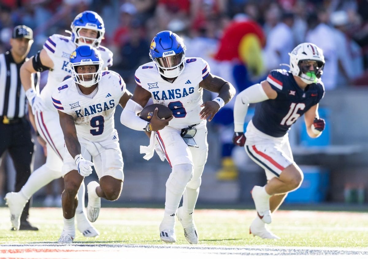 Nov 8, 2025; Tucson, Arizona, USA; Kansas Jayhawks quarterback Jalon Daniels (6) against the Arizona Wildcats at Arizona Stadium. Mandatory Credit: Mark J. Rebilas-Imagn Images