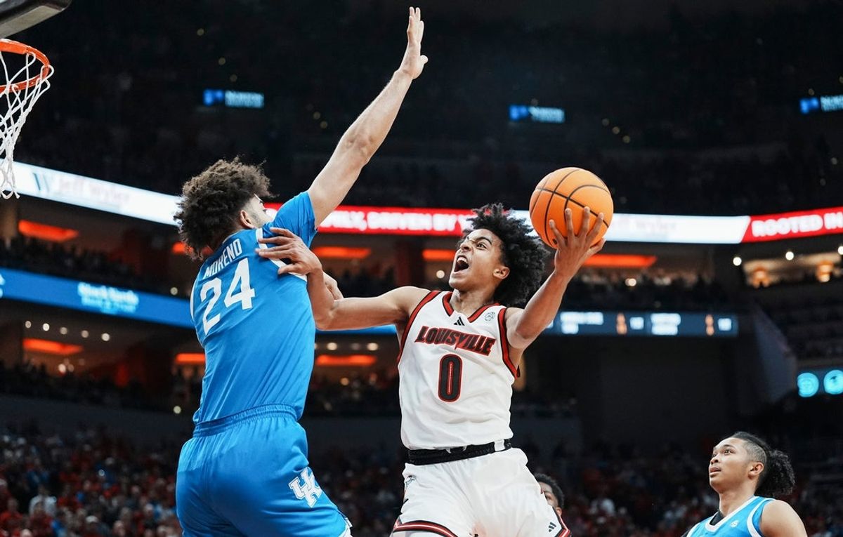 Louisville Cardinals guard Mikel Brown Jr. (0) goes for two as Kentucky Wildcats center Malachi Moreno (24) pressures during the two schools' rivalry game at the KFC Yum! Center in Louisville, Kentucky Nov. 11, 2025.