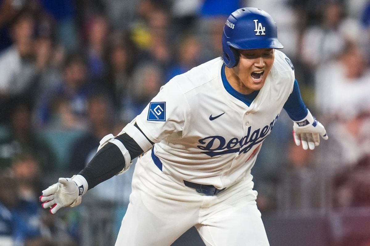 Los Angeles Dodgers designated hitter Shohei Ohtani (17) celebrates as he runs for first on an RBI single in the sixth inning of the MLB National League Wild Card Game 2 between the Los Angeles Dodgers and the Cincinnati Reds at Dodger Stadium in Los Angeles on Wednesday, Oct. 1, 2025. The Reds were eliminated from the postseason with an 8-4 loss to the reigning World Series Champions Dodgers.