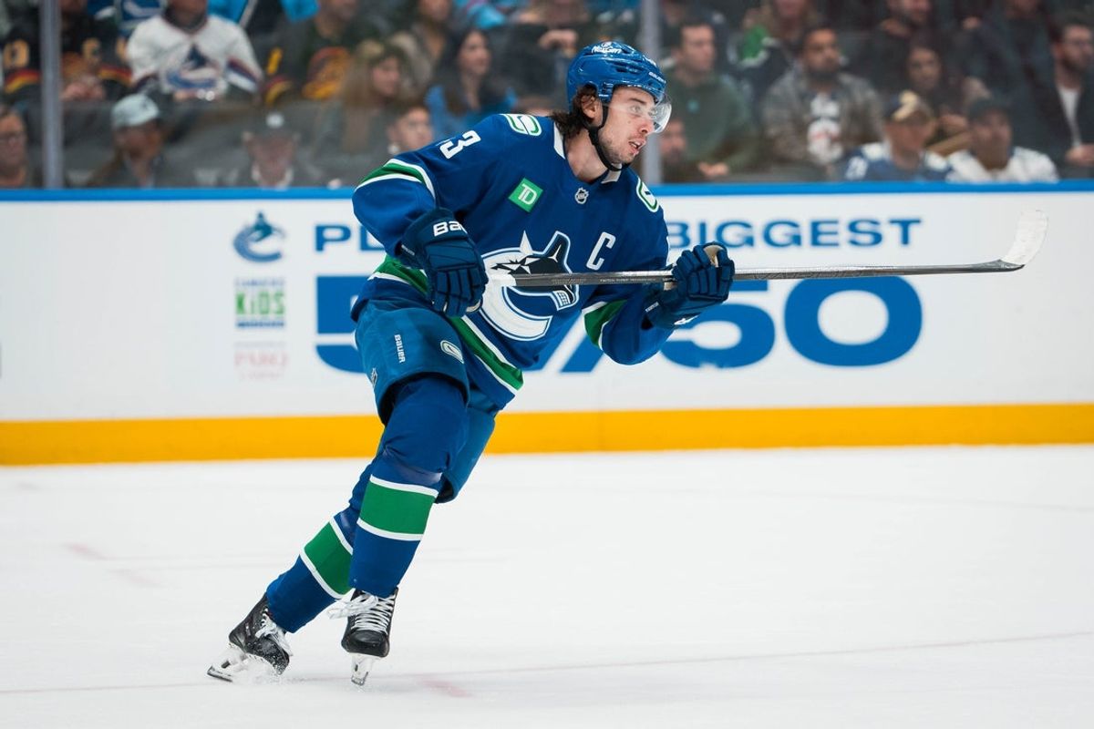 Nov 11, 2025; Vancouver, British Columbia, CAN; Vancouver Canucks defenseman Quinn Hughes (43) skates against the Winnipeg Jets in the first period at Rogers Arena. Mandatory Credit: Bob Frid-Imagn Images