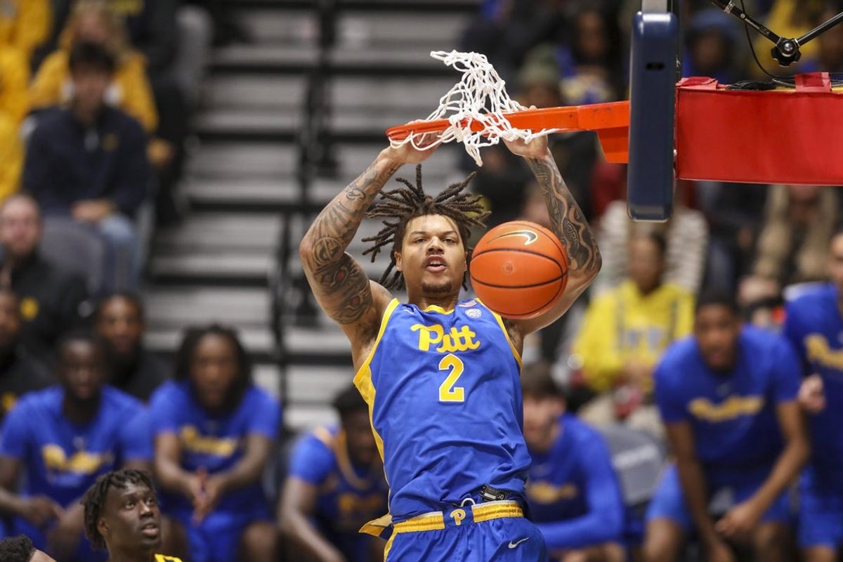 Nov 13, 2025; Morgantown, West Virginia, USA; Pittsburgh Panthers forward Cameron Corhen (2) dunks the ball during the second half against the West Virginia Mountaineers at WVU Coliseum. Mandatory Credit: Ben Queen-Imagn Images