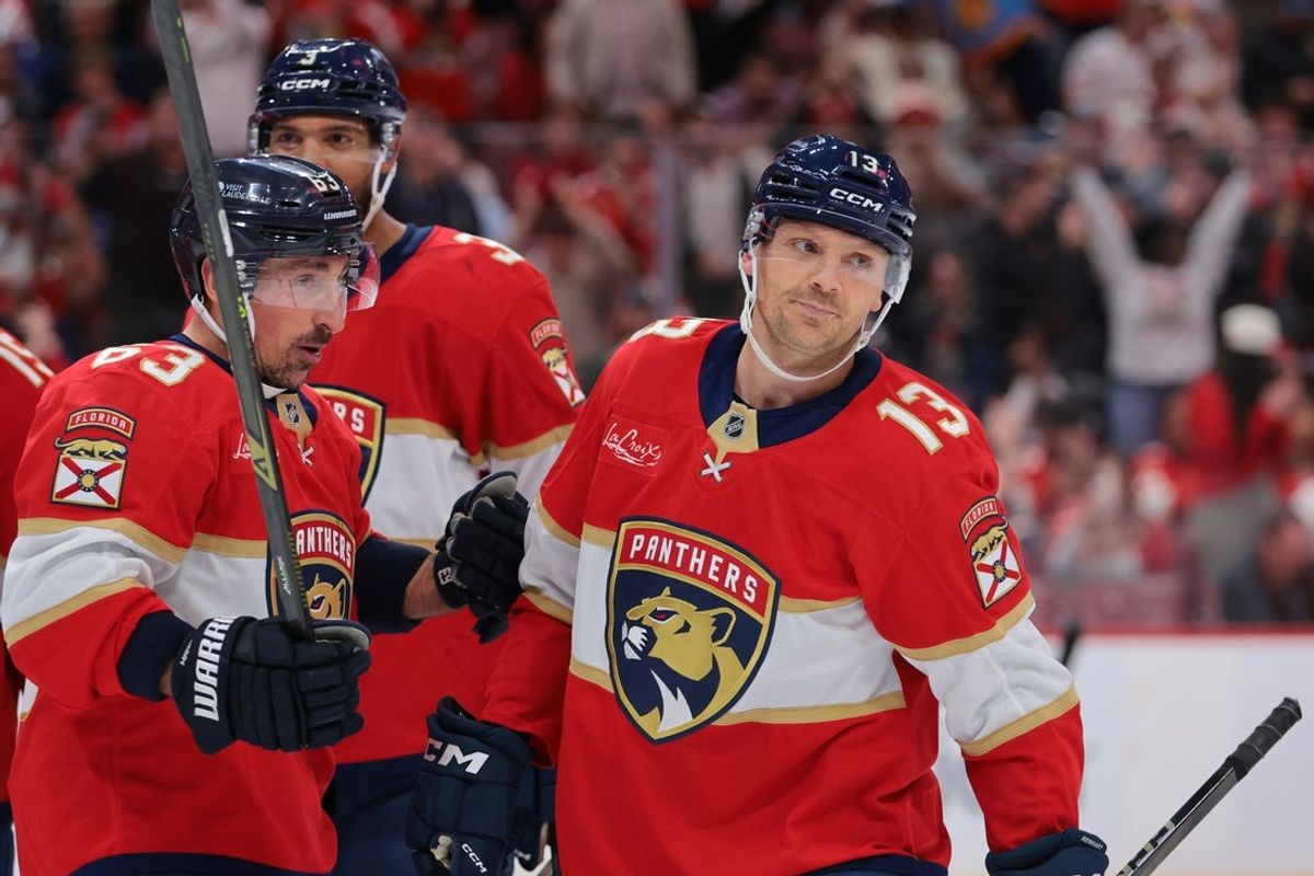 Nov 13, 2025; Sunrise, Florida, USA; Florida Panthers center Sam Reinhart (13) celebrates with left wing Brad Marchand (63) after scoring against the Washington Capitals during the second period at Amerant Bank Arena. Mandatory Credit: Sam Navarro-Imagn Images