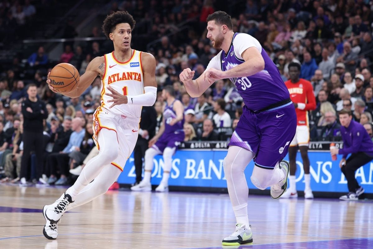 Nov 13, 2025; Salt Lake City, Utah, USA; Atlanta Hawks forward Jalen Johnson (1) drives against Utah Jazz center Jusuf Nurkic (30) during the first quarter at Delta Center. Mandatory Credit: Rob Gray-Imagn Images