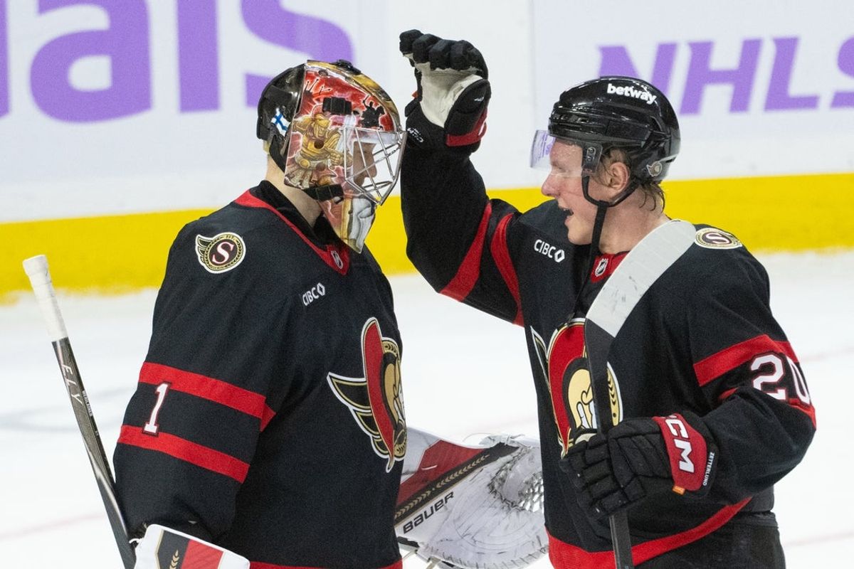 Nov 13, 2025; Ottawa, Ontario, CAN; Ottawa Senators goalie Leevi Merilainen (1) is congratulated by left wing Fabian Zetterlund (20) following a win against the Boston Bruins at the Canadian Tire Centre. Mandatory Credit: Marc DesRosiers-IMAGN Images