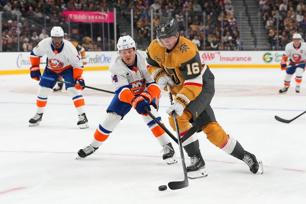 Nov 13, 2025; Las Vegas, Nevada, USA; Vegas Golden Knights right wing Pavel Dorofeyev (16) skates against New York Islanders defenseman Adam Boqvist (34) during the first period at T-Mobile Arena. Mandatory Credit: Stephen R. Sylvanie-Imagn Images