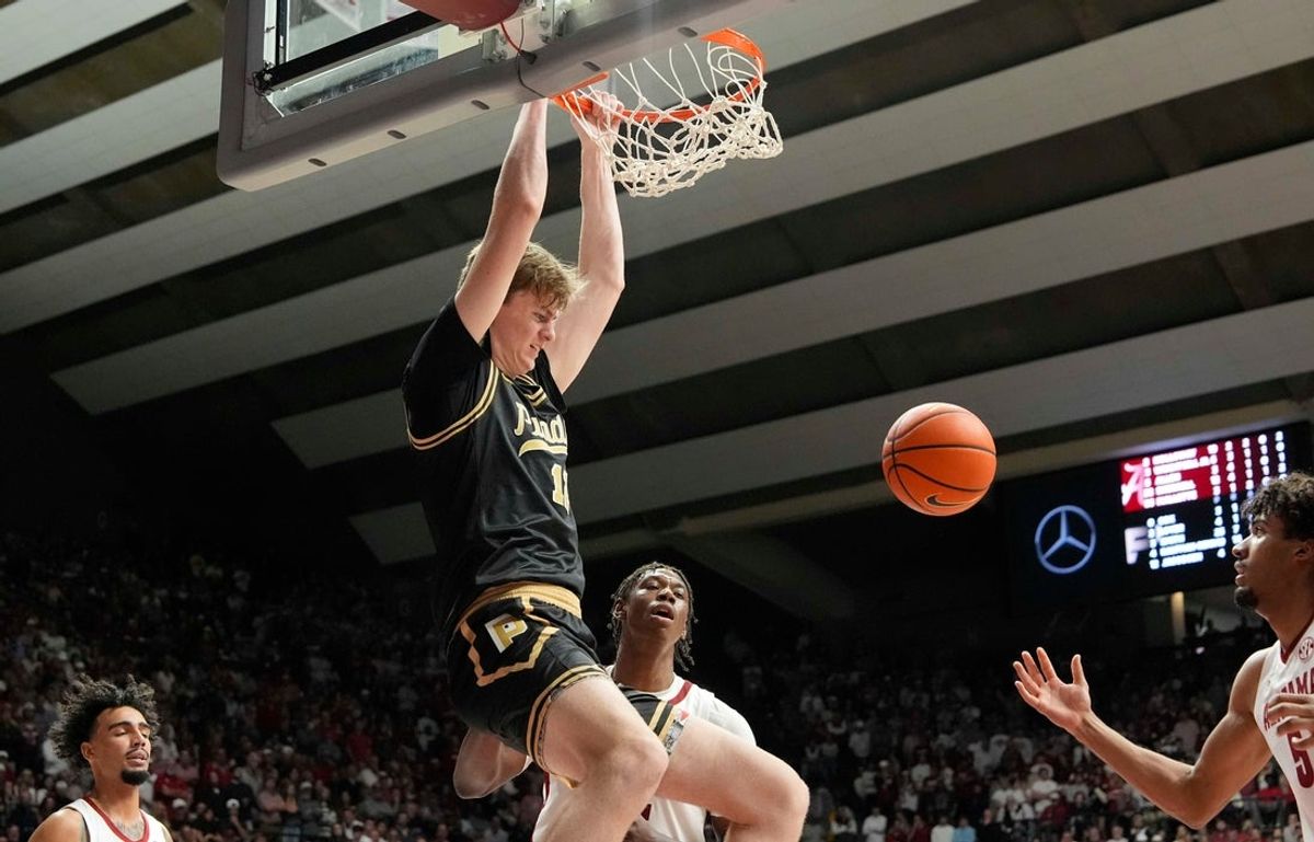 Nov 13, 2025; Tuscaloosa, Alabama, USA; Purdue center Daniel Jacobsen (12) dunks against Alabama at Coleman Coliseum. Purdue defeated Alabama 87-80. Mandatory Credit: Gary Cosby Jr.-Tuscaloosa News