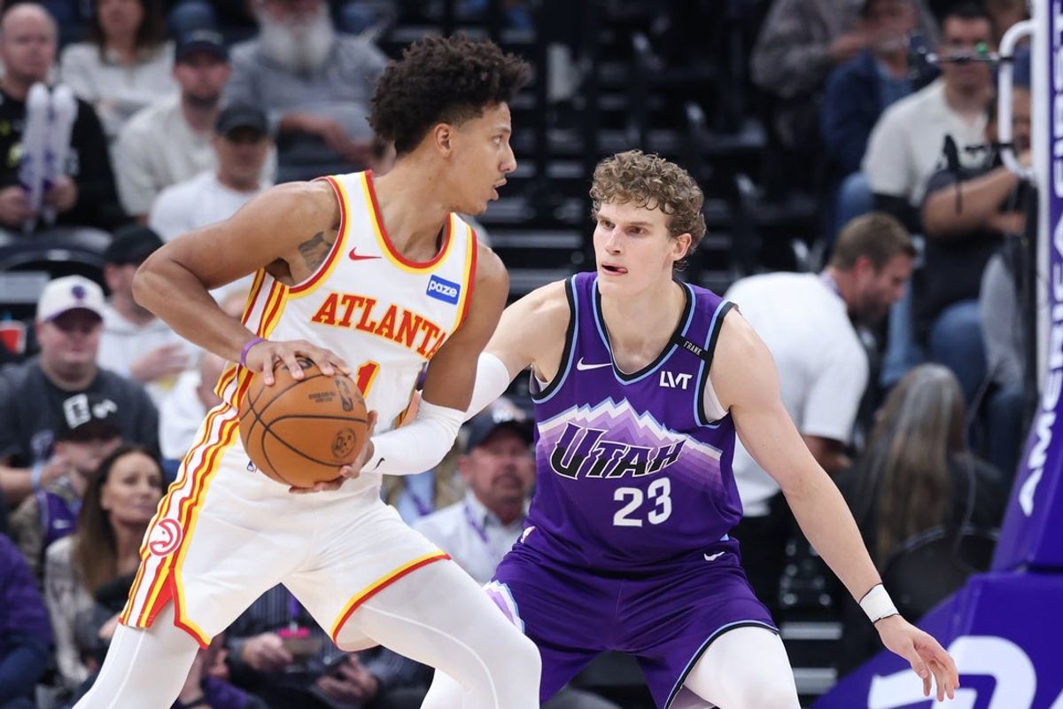 Nov 13, 2025; Salt Lake City, Utah, USA; Atlanta Hawks forward Jalen Johnson (1) looks to drive against Utah Jazz forward Lauri Markkanen (23) during the second half at Delta Center. Mandatory Credit: Rob Gray-Imagn Images