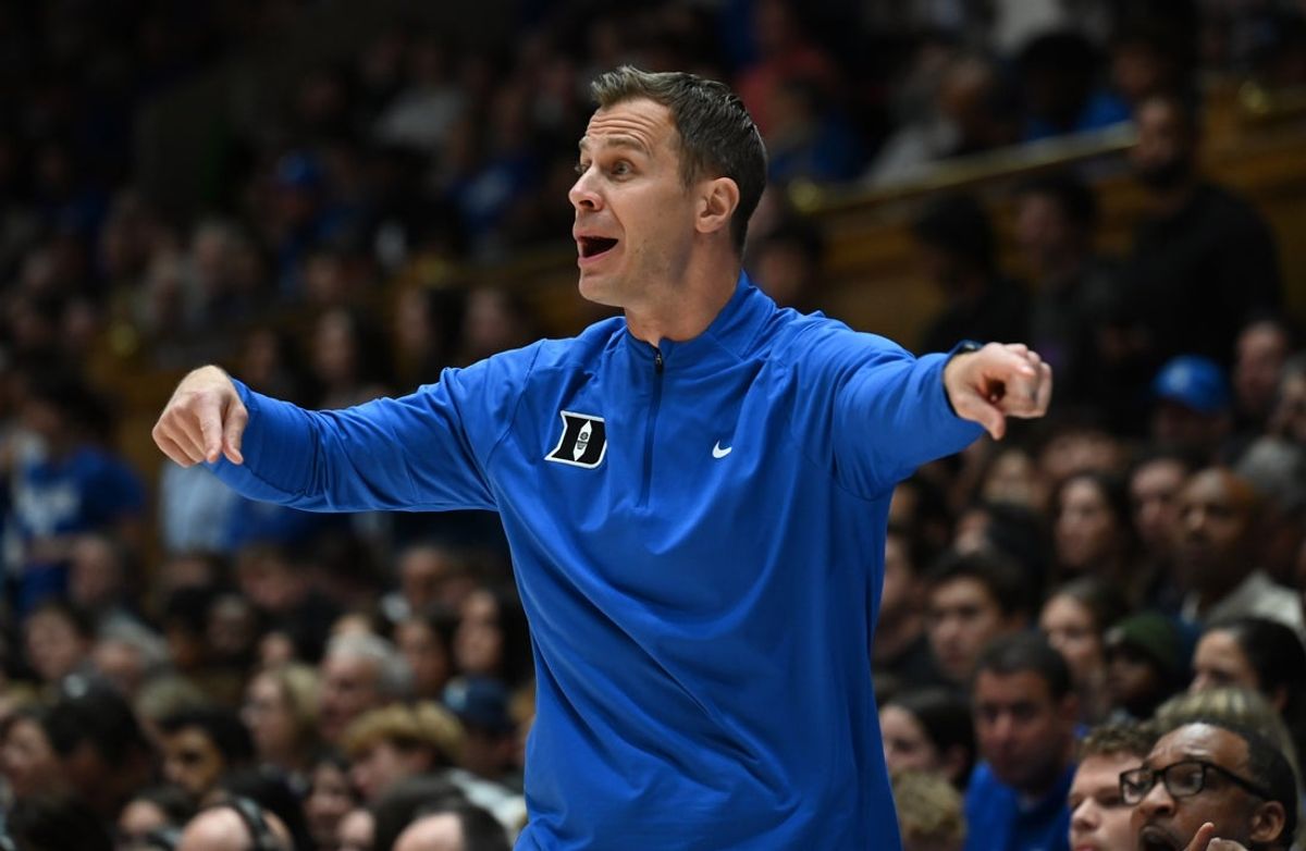 Nov 14, 2025; Durham, North Carolina, USA;  Duke Blue Devils head coach Jon Scheyer directs his team during the first half against the Indiana State Sycamores at Cameron Indoor Stadium. Mandatory Credit: Rob Kinnan-Imagn Images