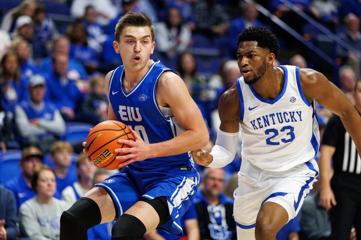 Nov 14, 2025; Lexington, Kentucky, USA; Eastern Illinois Panthers forward Kooper Jacobi (40) drives to the basket around Kentucky Wildcats forward Mouhamed Dioubate (23) during the first half at Rupp Arena at Central Bank Center. Mandatory Credit: Jordan Prather-Imagn Images