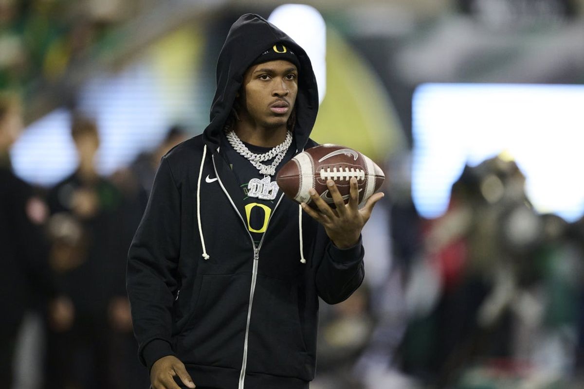 Nov 14, 2025; Eugene, Oregon, USA; Oregon Ducks wide receiver Dakorien Moore (1) watches teammates warm up before a game against the Minnesota Golden Gophers at Autzen Stadium. Mandatory Credit: Troy Wayrynen-Imagn Images
