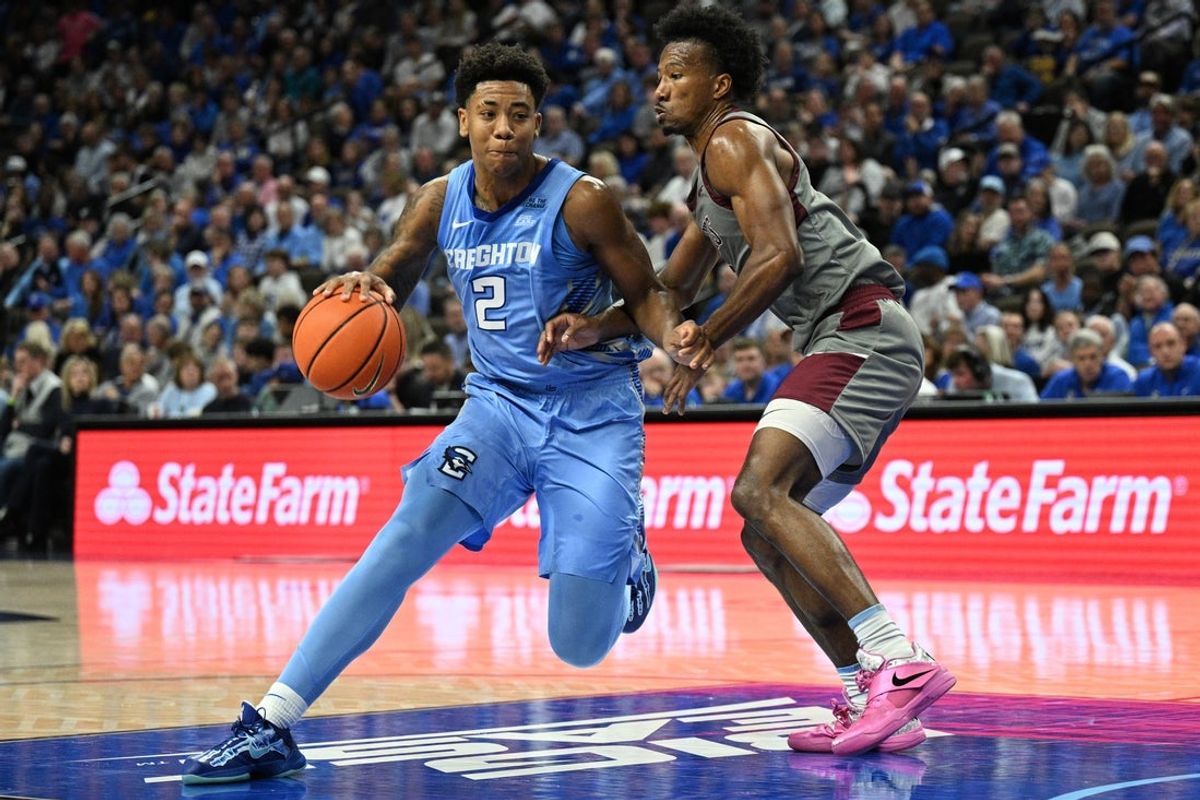 Nov 14, 2025; Omaha, Nebraska, USA;  Creighton Bluejays guard Blake Harper (2) drives against Maryland Eastern Shore Hawks guard Jaden Cooper (0) during the first half at CHI Health Center Omaha. Mandatory Credit: Steven Branscombe-Imagn Images