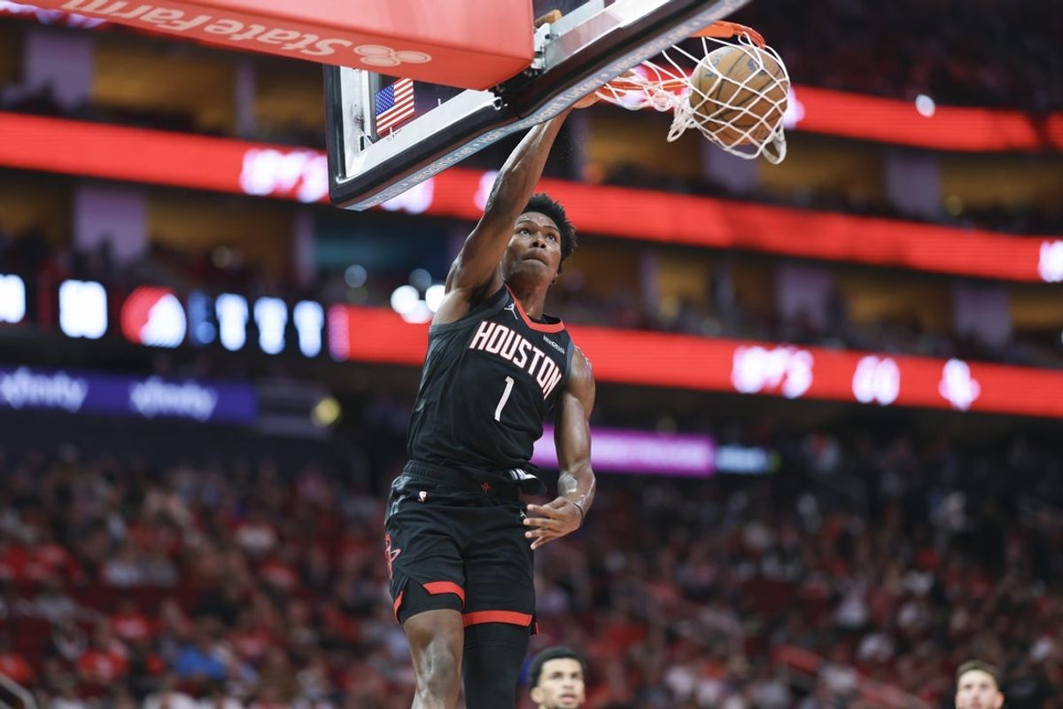 Nov 14, 2025; Houston, Texas, USA;  Houston Rockets guard Amen Thompson (1) dunks the ball during the second quarter against the Portland Trail Blazers at Toyota Center. Mandatory Credit: Troy Taormina-Imagn Images