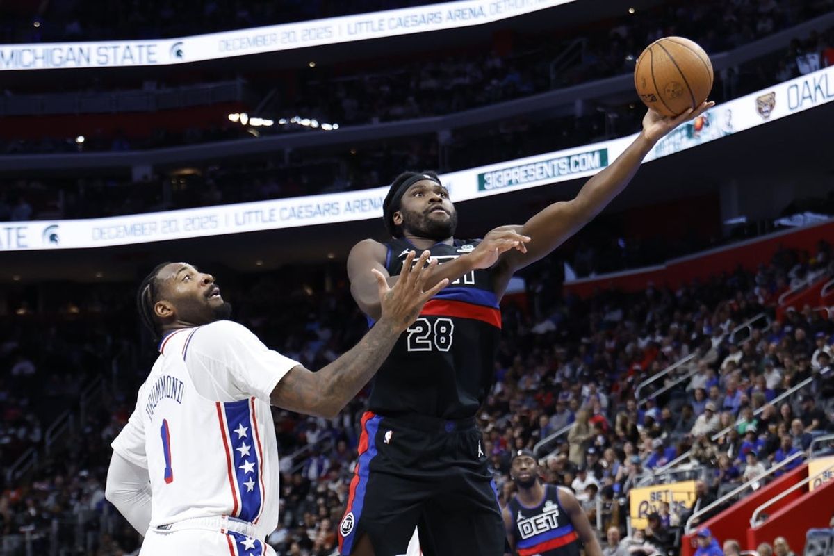 Nov 14, 2025; Detroit, Michigan, USA;  Detroit Pistons forward Isaiah Stewart (28) shoots on Philadelphia 76ers center Andre Drummond (1) in the second half at Little Caesars Arena. Mandatory Credit: Rick Osentoski-Imagn Images