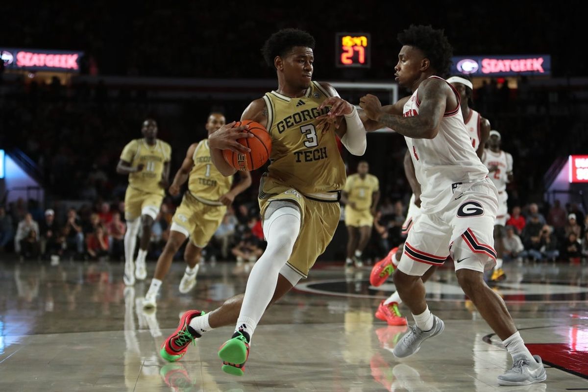 Nov 14, 2025; Athens, Georgia, USA; Georgia Tech Yellow Jackets guard Jaeden Mustaf (3) drives past against Georgia Bulldogs guard Marcus Millender (4) during the second half at Stegeman Coliseum. Mandatory Credit: Mady Mertens-Imagn Images