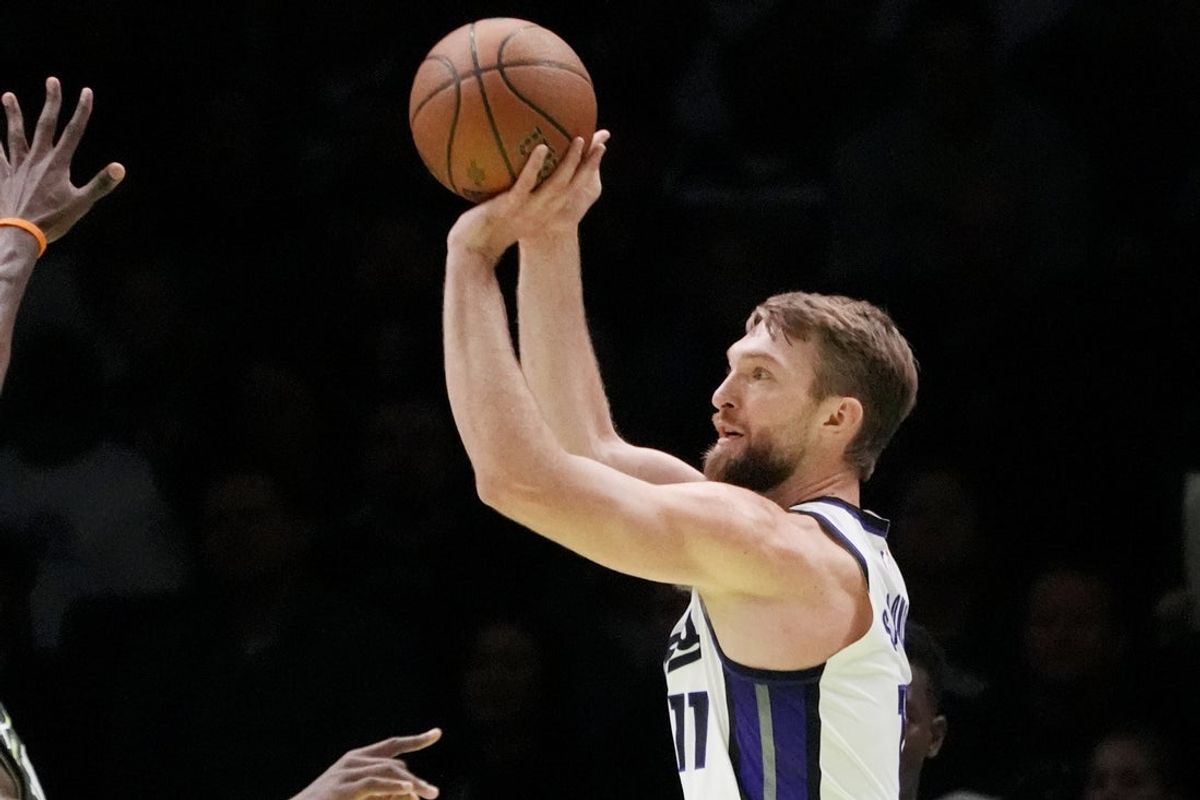 Nov 14, 2025; Minneapolis, Minnesota, USA; Sacramento Kings center Domantas Sabonis (11) shoots against the Minnesota Timberwolves in the first quarter at Target Center. Mandatory Credit: Bruce Kluckhohn-Imagn Images