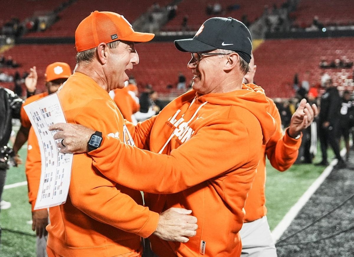 Clemson Tigers head coach Dabo Swinney, left, celebrates the Tigers' 20-19 win over host Louisville with Tom Allen, defensive coordinator, after the game at L&N Stadium in Louisville, Kentucky Friday, Nov. 14, 2025.