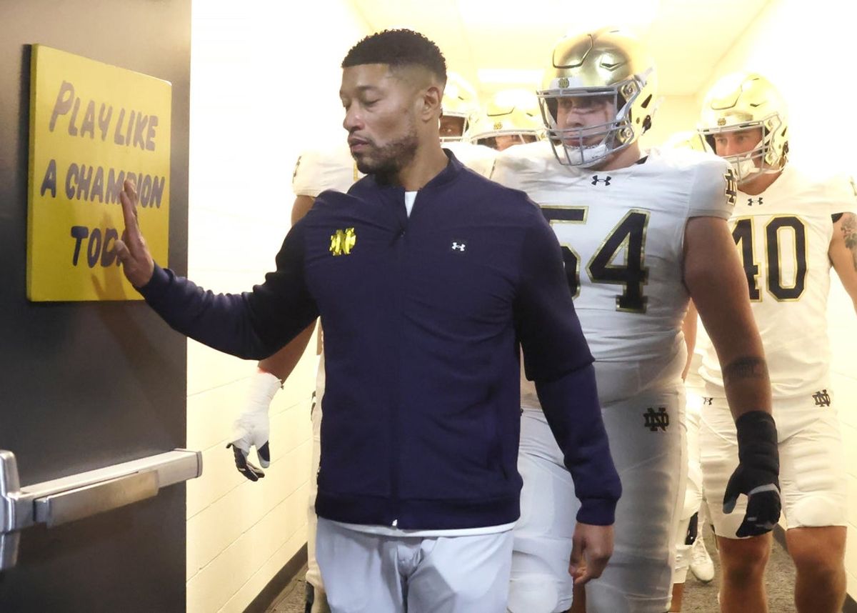 Nov 15, 2025; Pittsburgh, Pennsylvania, USA;  Notre Dame Fighting Irish head coach Marcus Freeman leads the team from the locker room to play the Pittsburgh Panthers at Acrisure Stadium. Mandatory Credit: Charles LeClaire-Imagn Images