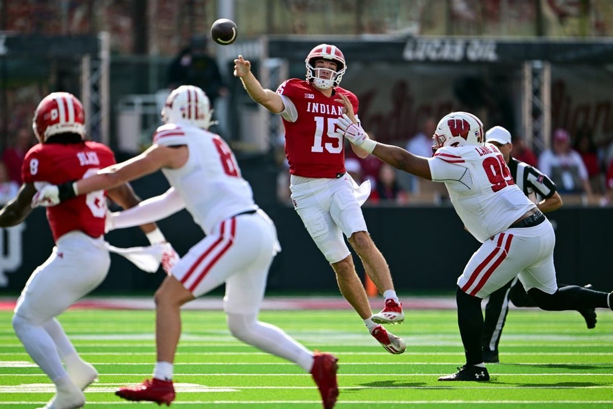 Nov 15, 2025; Bloomington, Indiana, USA; Indiana Hoosiers quarterback Fernando Mendoza (15) throws a pass during the first quarter against the Wisconsin Badgers at Memorial Stadium. Mandatory Credit: Marc Lebryk-Imagn Images
