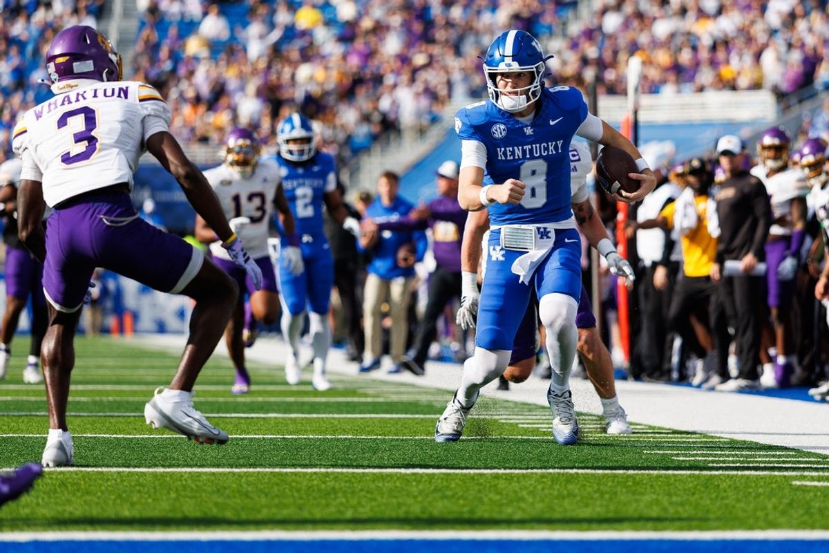 Nov 15, 2025; Lexington, Kentucky, USA; Kentucky Wildcats quarterback Cutter Boley (8) runs the ball for a touchdown during the first quarter against the Tennessee Tech Golden Eagles at Kroger Field. Mandatory Credit: Jordan Prather-Imagn Images