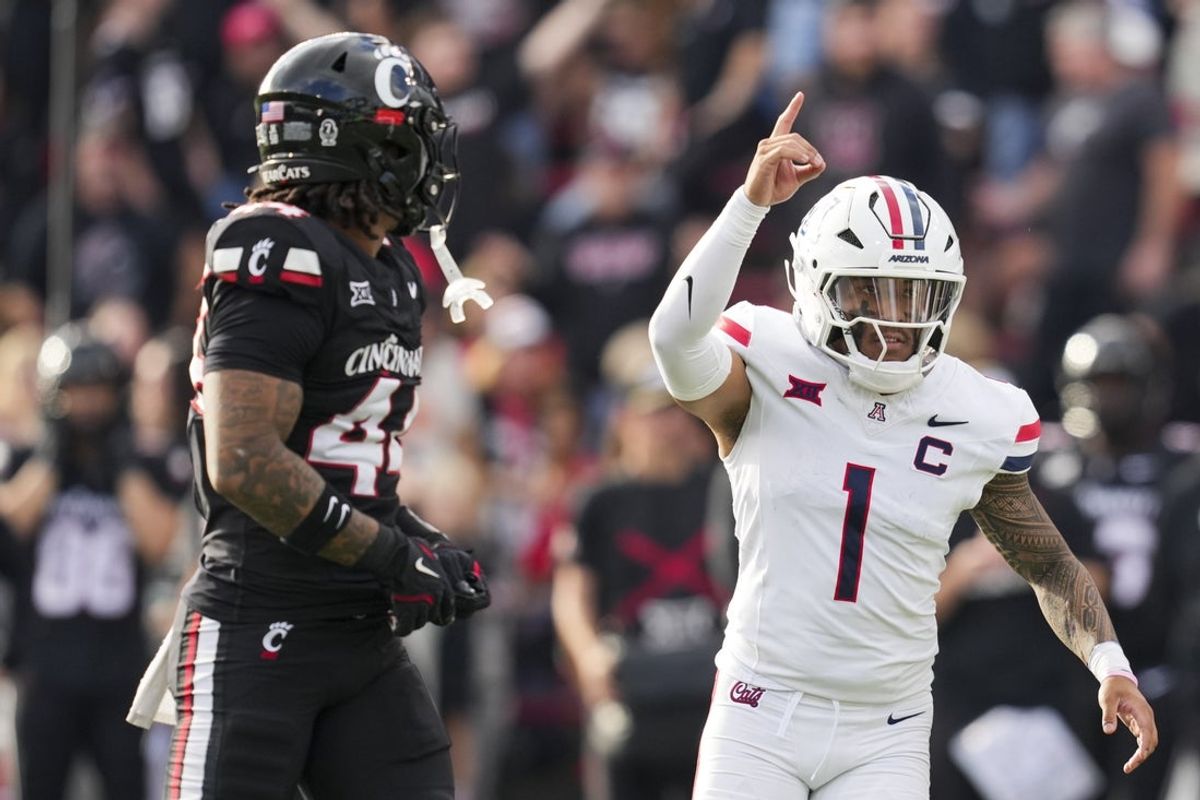 Nov 15, 2025; Cincinnati, Ohio, USA;  Arizona Wildcats quarterback Noah Fifita (1) reacts to throwing a touchdown against the Cincinnati Bearcats in the second half at Nippert Stadium. Mandatory Credit: Aaron Doster-Imagn Images