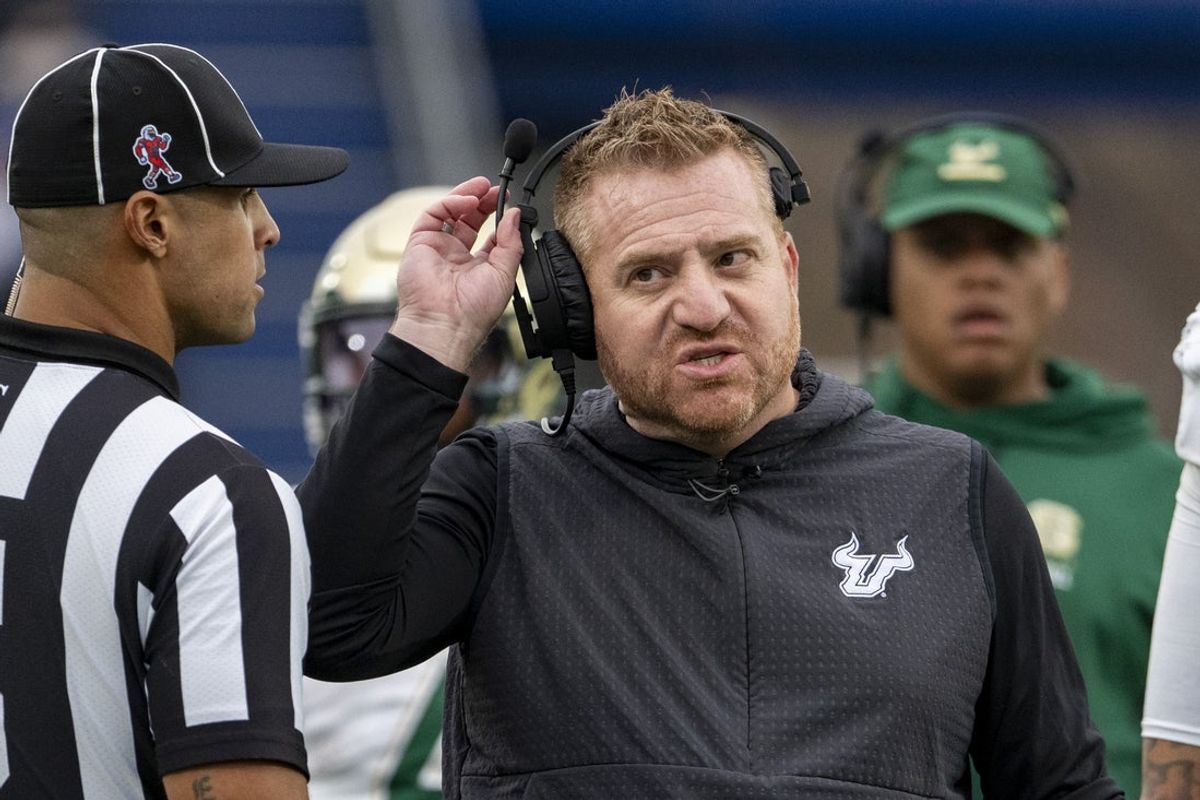 Nov 15, 2025; Annapolis, Maryland, USA;  South Florida Bulls head coach Alex Golesh speaks with  an official on the  sidelines during the second half against the Navy Midshipmen at Navy-Marine Corps Memorial Stadium. Navy Midshipmen defeated South Florida Bulls 41-28. Mandatory Credit: Tommy Gilligan-Imagn Images