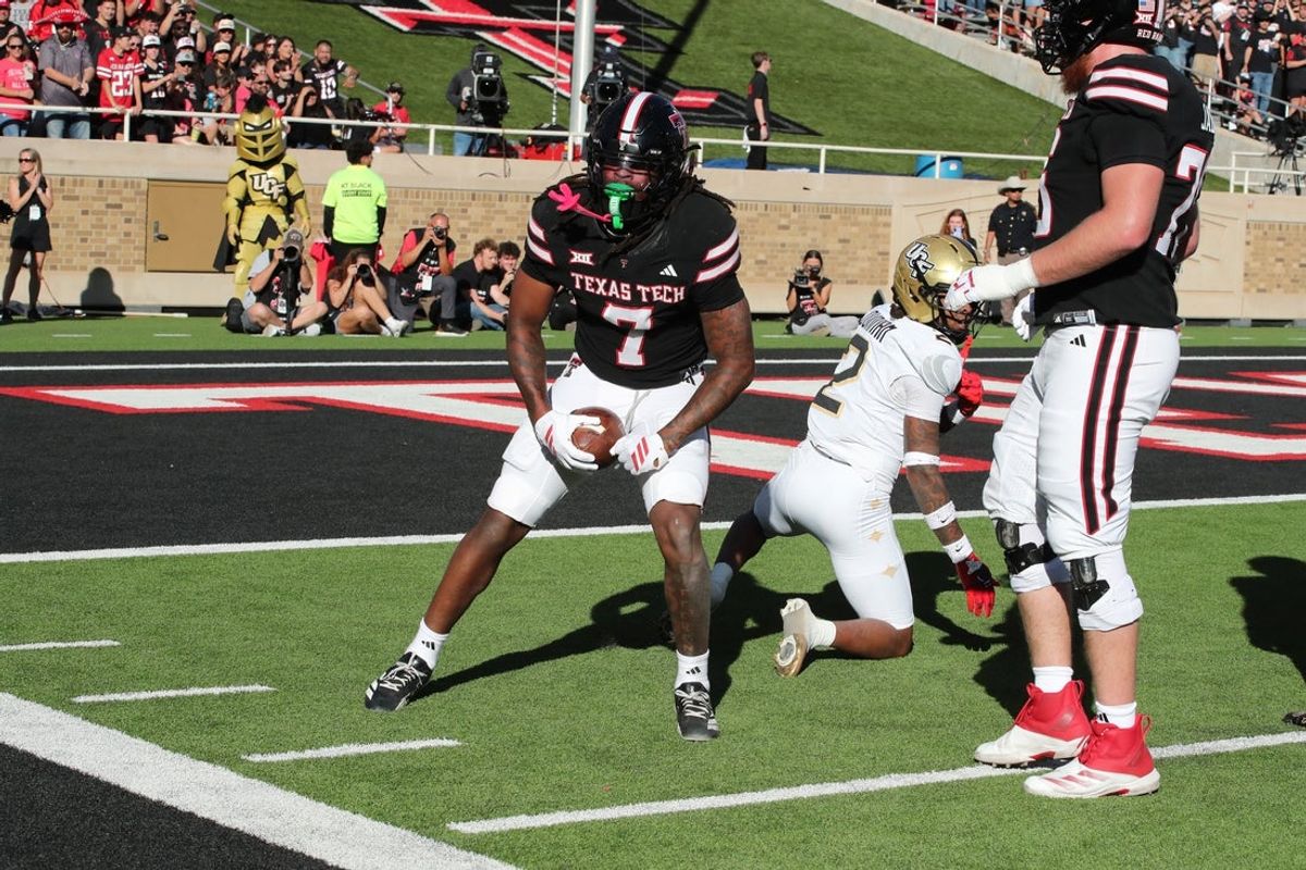 Nov 15, 2025; Lubbock, Texas, USA;  Texas Tech Red Raiders wide receiver Terrence Carter Jr. (7) reacts after catching a pass against Central Florida Knights defensive safety Phillip dunned (2) in the first half at Jones AT&T Stadium. Mandatory Credit: Michael C. Johnson-Imagn Images