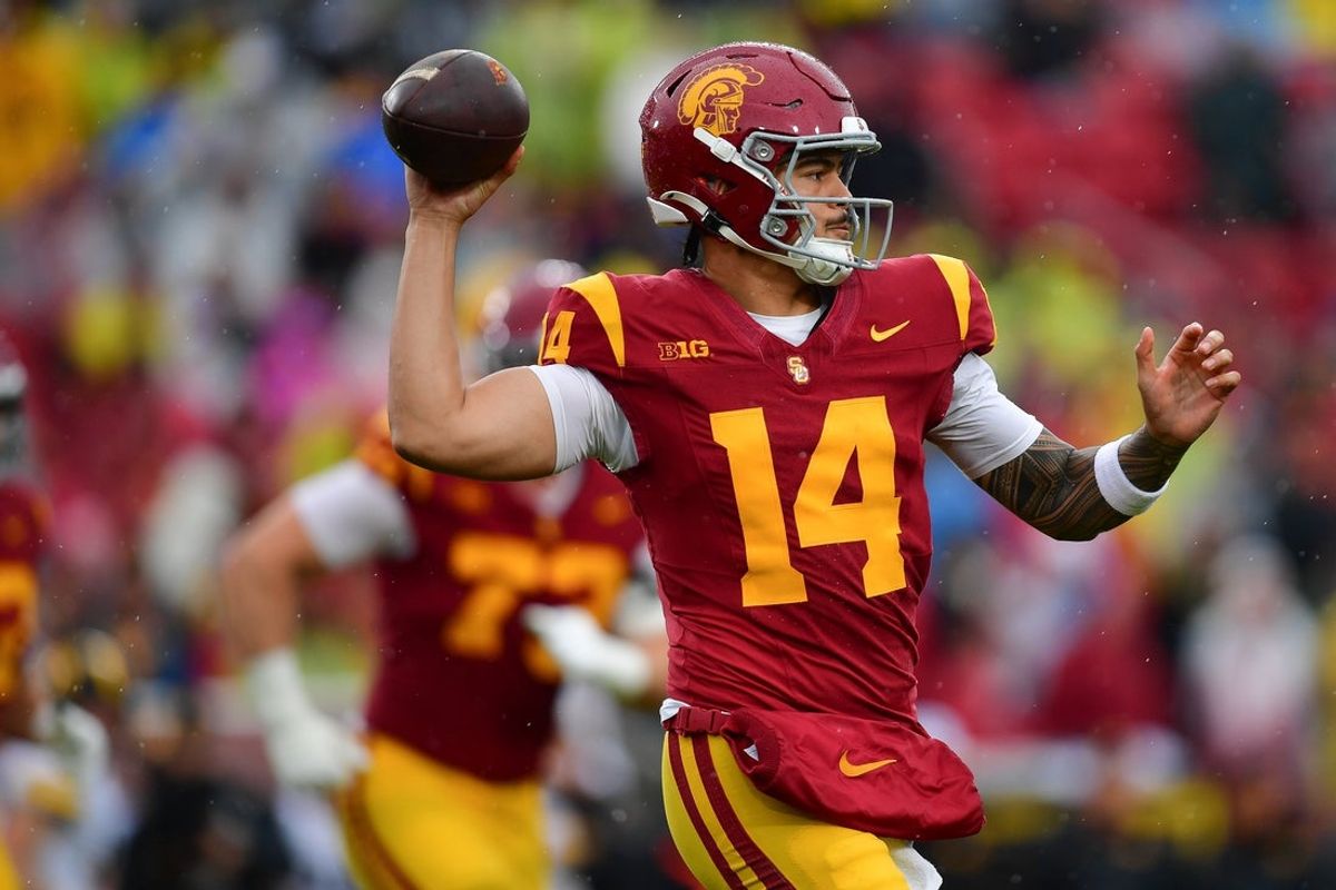 Nov 15, 2025; Los Angeles, California, USA; Southern California Trojans quarterback Jayden Maiava (14) throws against the Iowa Hawkeyes during the first half at the Los Angeles Memorial Coliseum. Mandatory Credit: Gary A. Vasquez-Imagn Images