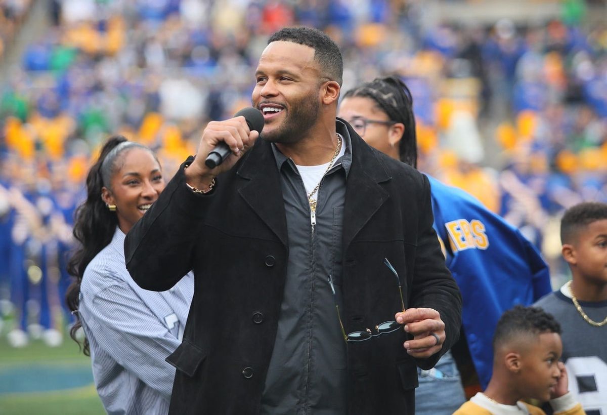 Former Pittsburgh Panther and retired NFL defensive tackle Aaron Donald speaks to the crowd during his jersey number retirement ceremony during halftime of the Pittsburgh Panthers vs Notre Dame Fighting Irish game at Acrisure Stadium in Pittsburgh, PA on November 15, 2025.
