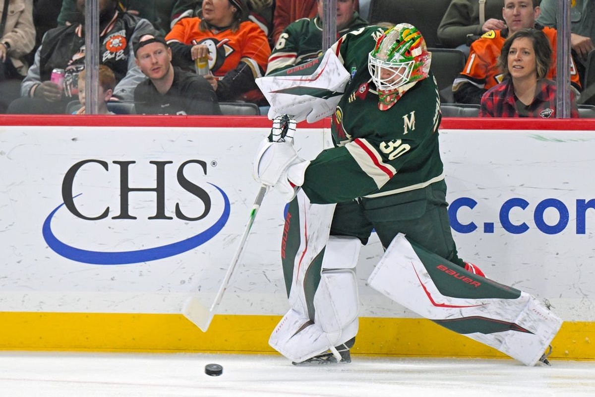 Nov 15, 2025; Saint Paul, Minnesota, USA;  Minnesota Wild goalie Jesper Wallstedt (30) makes a pass against the Anaheim Ducks during the first period at Grand Casino Arena. Mandatory Credit: Nick Wosika-Imagn Images