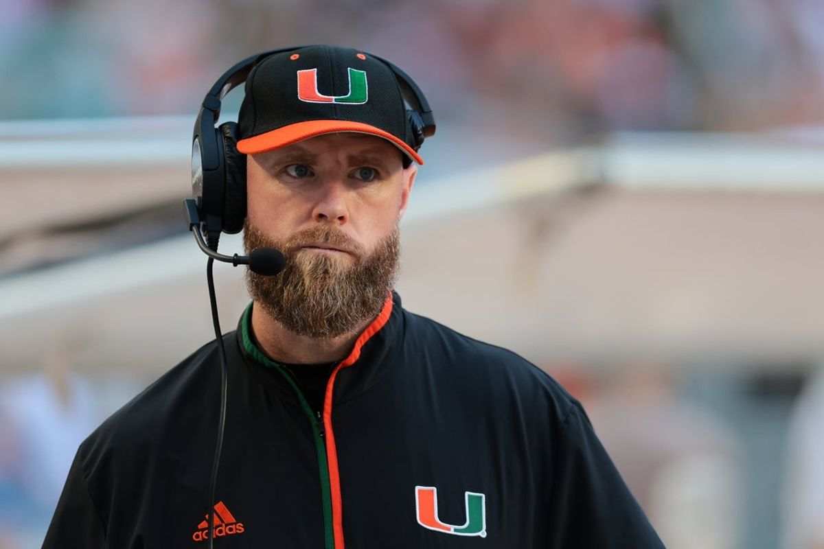 Nov 15, 2025; Miami Gardens, Florida, USA; against the Miami Hurricanes defensive coordinator Corey Hetherman watches from the sideline before the game against NC State Wolfpack at Hard Rock Stadium. Mandatory Credit: Sam Navarro-Imagn Images