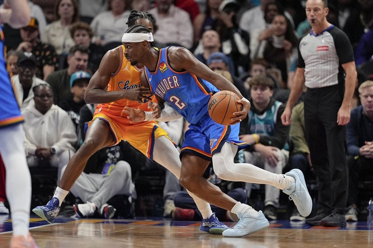 Nov 15, 2025; Charlotte, North Carolina, USA; Oklahoma City Thunder guard Shai Gilgeous-Alexander (2) drives to the basket against the Charlotte Hornets during the first half  at Spectrum Center. Mandatory Credit: Jim Dedmon-Imagn Images