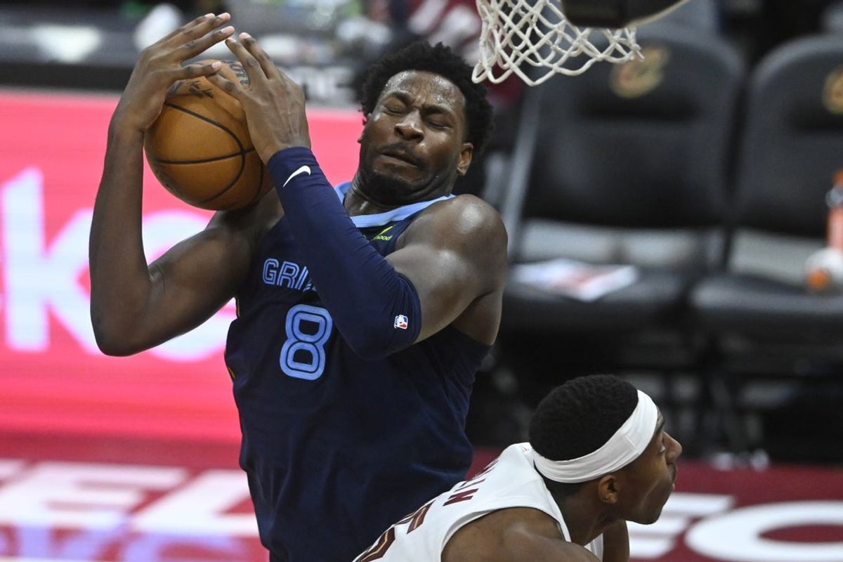 Nov 15, 2025; Cleveland, Ohio, USA; Memphis Grizzlies forward Jaren Jackson Jr. (8) rebounds beside Cleveland Cavaliers forward Nae'Qwan Tomlin (35) in the fourth quarter at Rocket Arena. Mandatory Credit: David Richard-Imagn Images