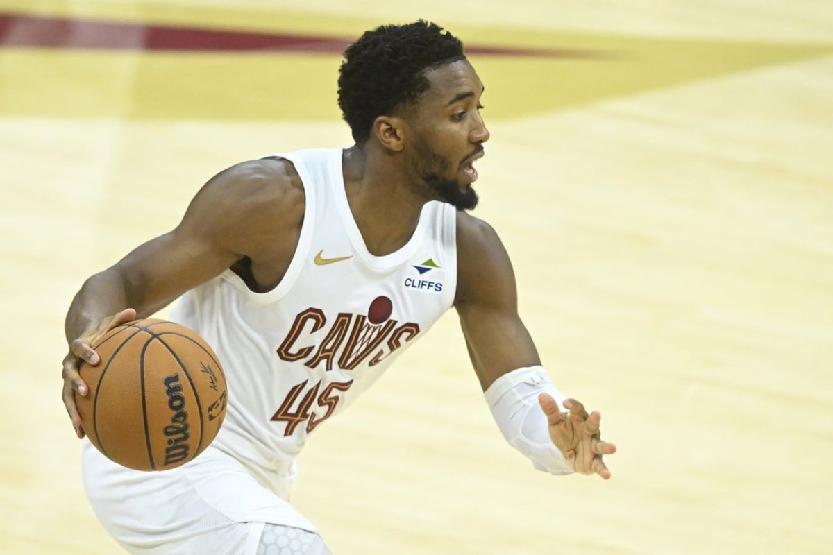 Nov 15, 2025; Cleveland, Ohio, USA; Cleveland Cavaliers guard Donovan Mitchell (45) dribbles the ball in the fourth quarter against the Memphis Grizzlies at Rocket Arena. Mandatory Credit: David Richard-Imagn Images