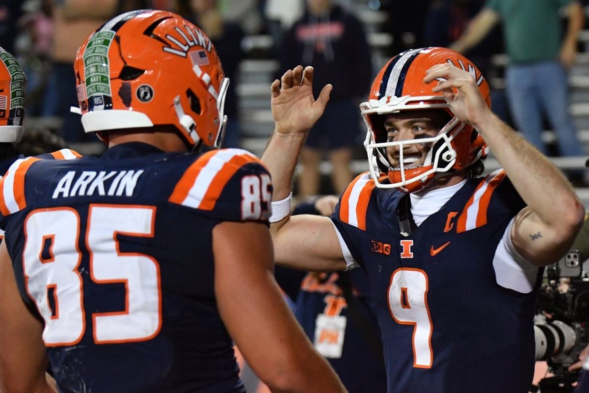 Nov 15, 2025; Champaign, Illinois, USA; Illinois Fighting Illini quarterback Luke Altmyer (9) celebrates a play with tight end Tanner Arkin (85) Maryland Terrapins during the second half at Memorial Stadium. Mandatory Credit: Ron Johnson-Imagn Images